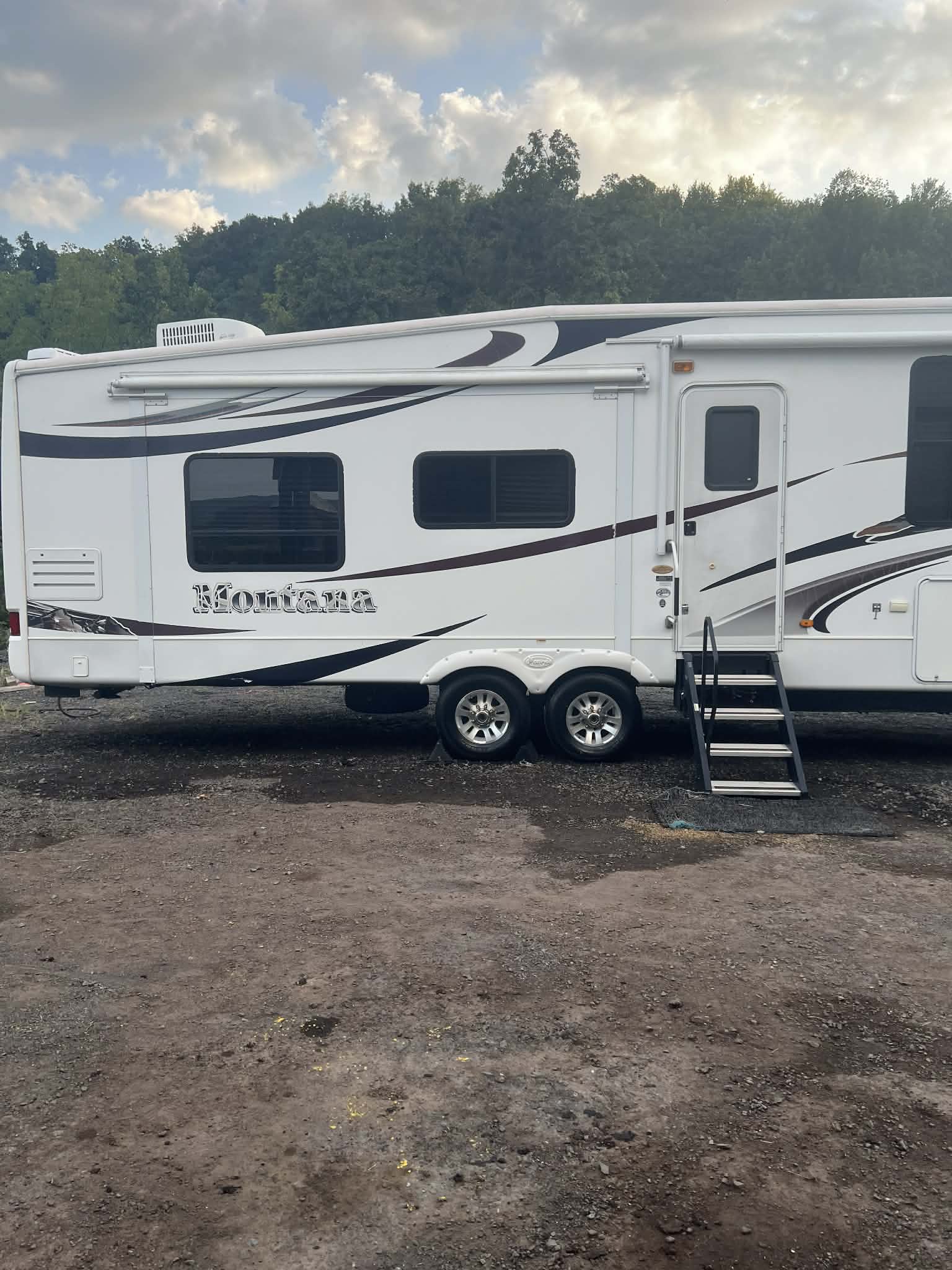 Montana fifth-wheel RV after mobile wash — bright clean finish